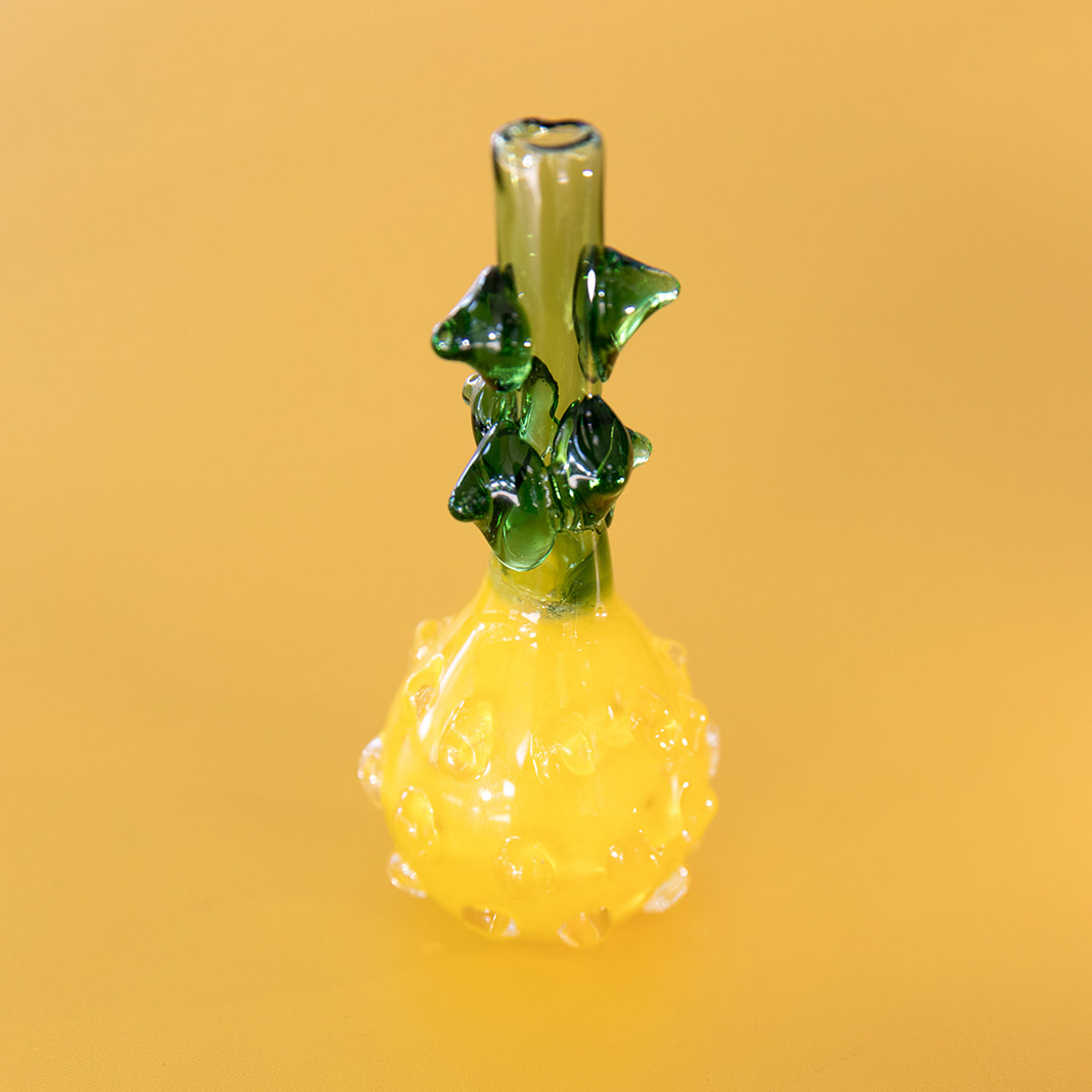 yellow and green glass pipe